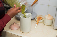 Long cylindrical jar with lid