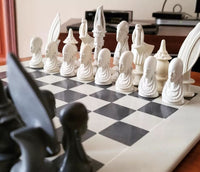 White and black chess pieces on a checkered board